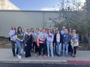 Group of teachers standing outside a building