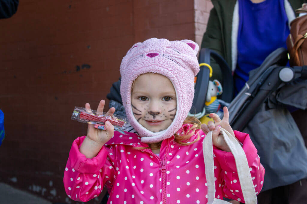 Trick or Treating girl with cat facepaint