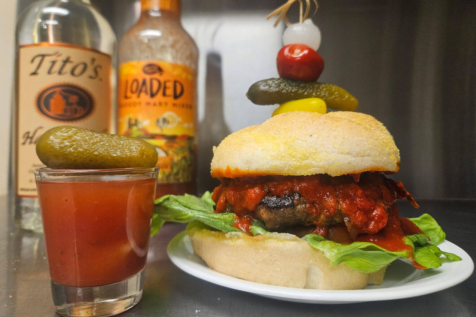 Elaborate burger with a mini-bloody mary as part of the Vermillion Burger Battle