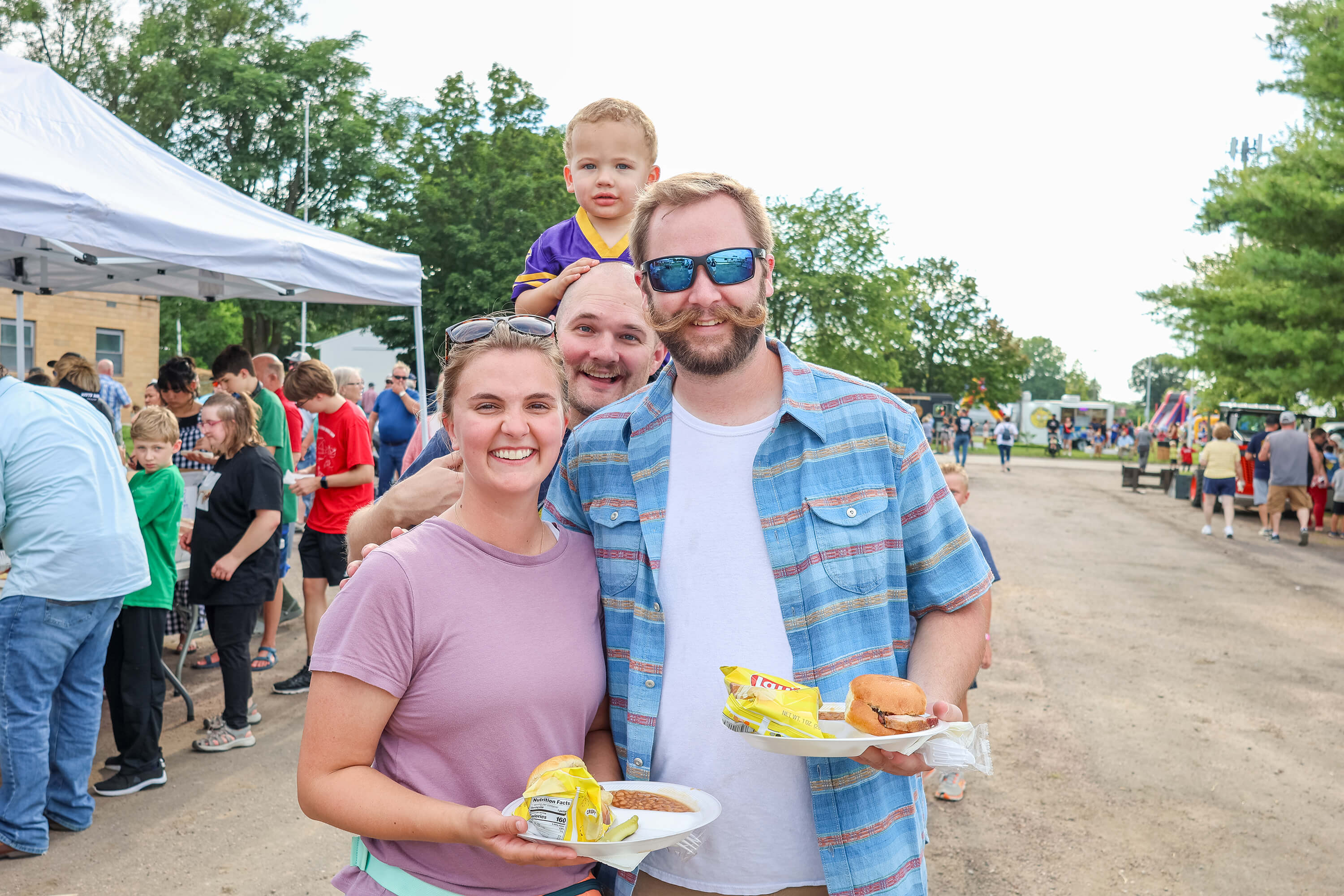 Family enjoying food at outside festival