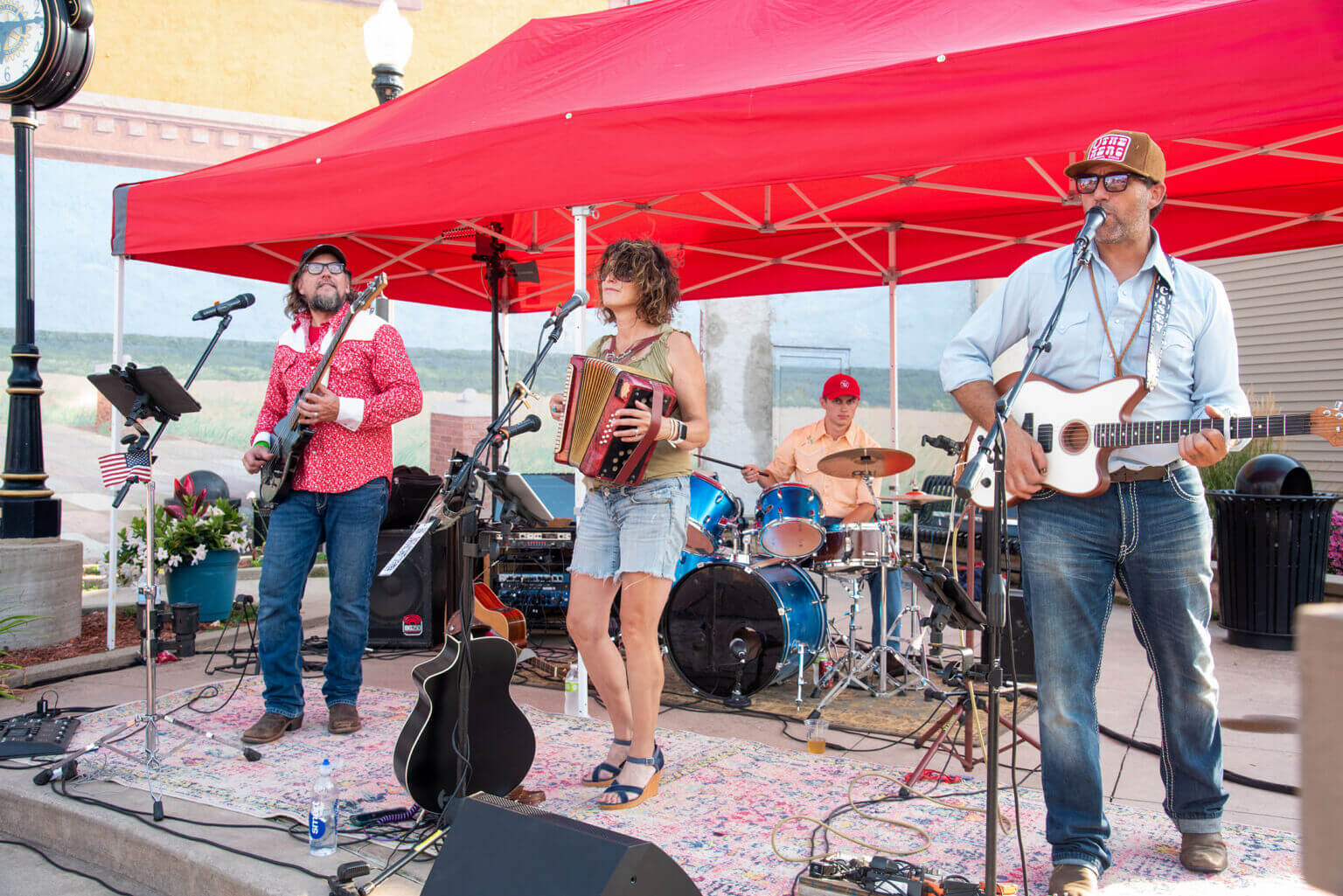 Four musicians perform outside at Thursdays On The Platz