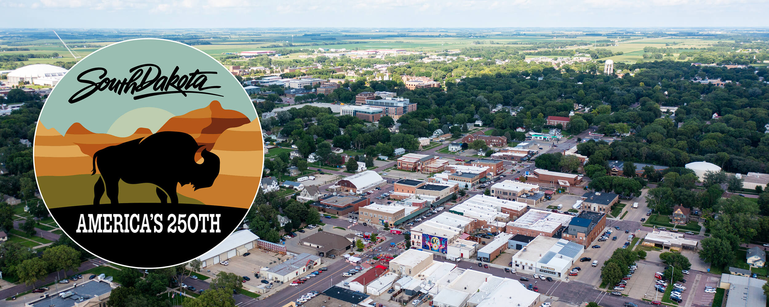 A drone shot of downtown Vermillion with the South Dakota America's 250th Sticker.