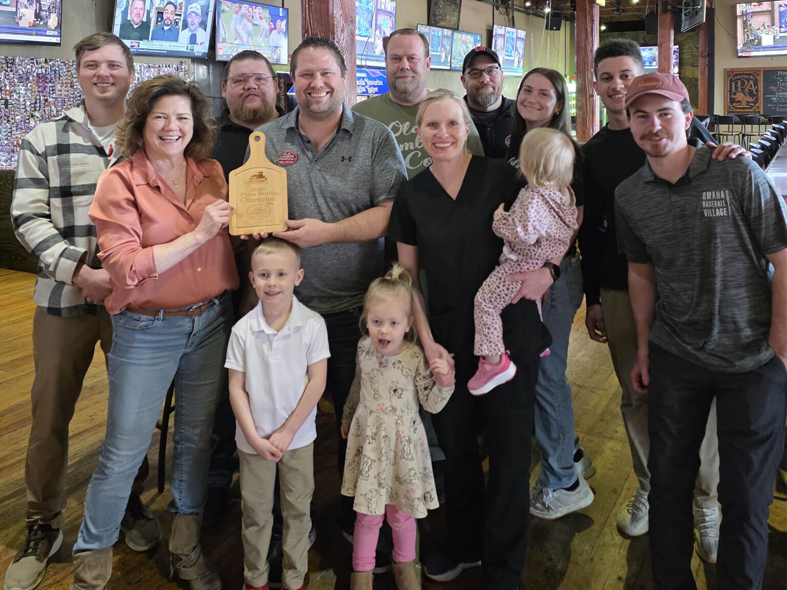 Old Lumber Company owners and staff with the Vermillion Pizza Battle plaque.