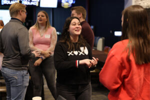Woman at The Chamber's Young Professionals Network. also known as YPN, connecting with a fellow attendee