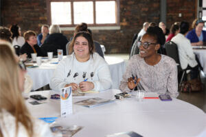 Attendees engage in conversation at the Inclusion Insights session on March 12.