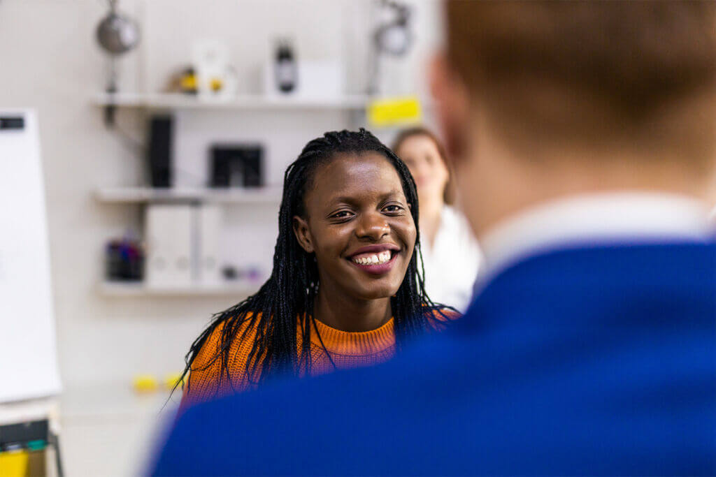 Young woman smiles during her work-based learning experience