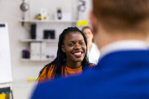 Young woman smiles during her work-based learning experience