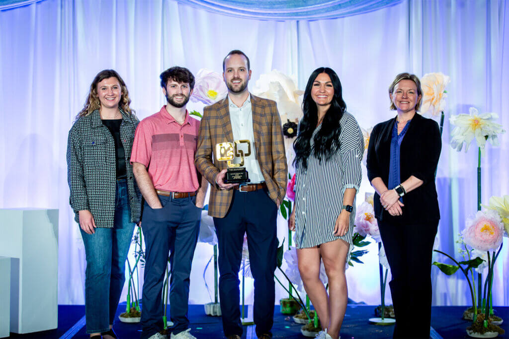 2025 ChamberChoice Business of the Year, Steffes Group team members stand on stage at the 2025 ChamberChoice Awards holding their award