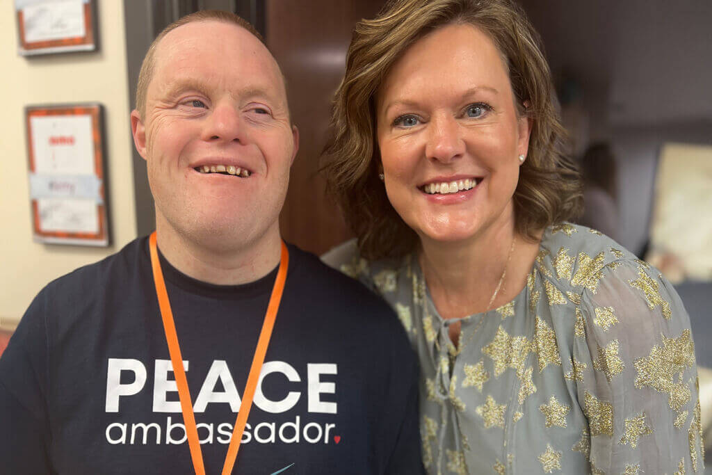 A Peace Academy employee and Peace Ambassador model early education inclusion in action. Peace Academy is the ChamberChoice Inclusion Champion of the Year.