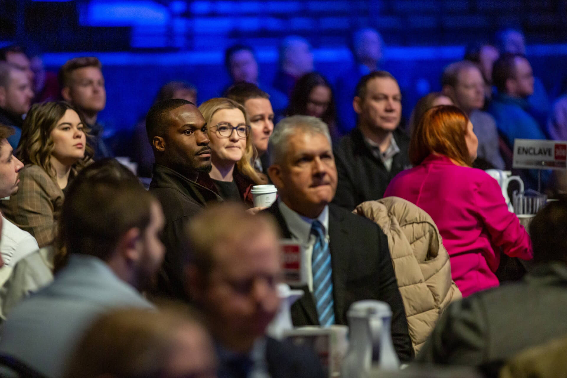 7-25_BlogHeader-MTSummit Attendees seated in the audience at the Midwest Tech Summit, listening intently to speakers on innovation, AI and the future of technology.