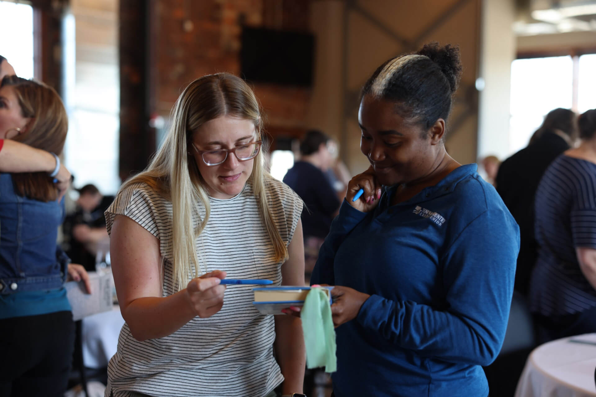 Two women having a conversation at the June Women Connect event, Chapters of Change
