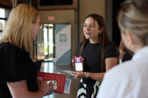 Women sharing their favorite self-improvement tools at a recent Women Connect event, Chapters of Change.