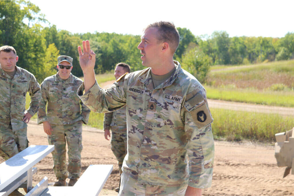 Minnesota National Guard member speaking on leadership to Chamber members at Camp Ripley near Little Falls, Minn.