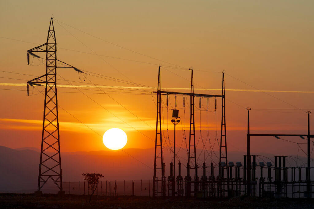 Image representing how energy affects your business - towers before the sunset