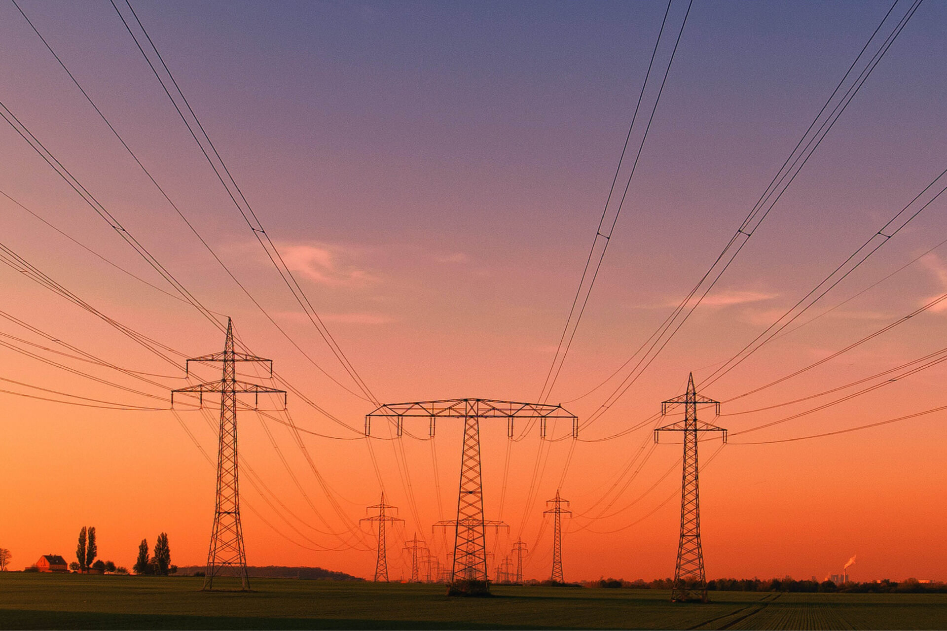 Sunset over power lines and open fields, highlighting the energy trends driving innovation across the Midwest.
