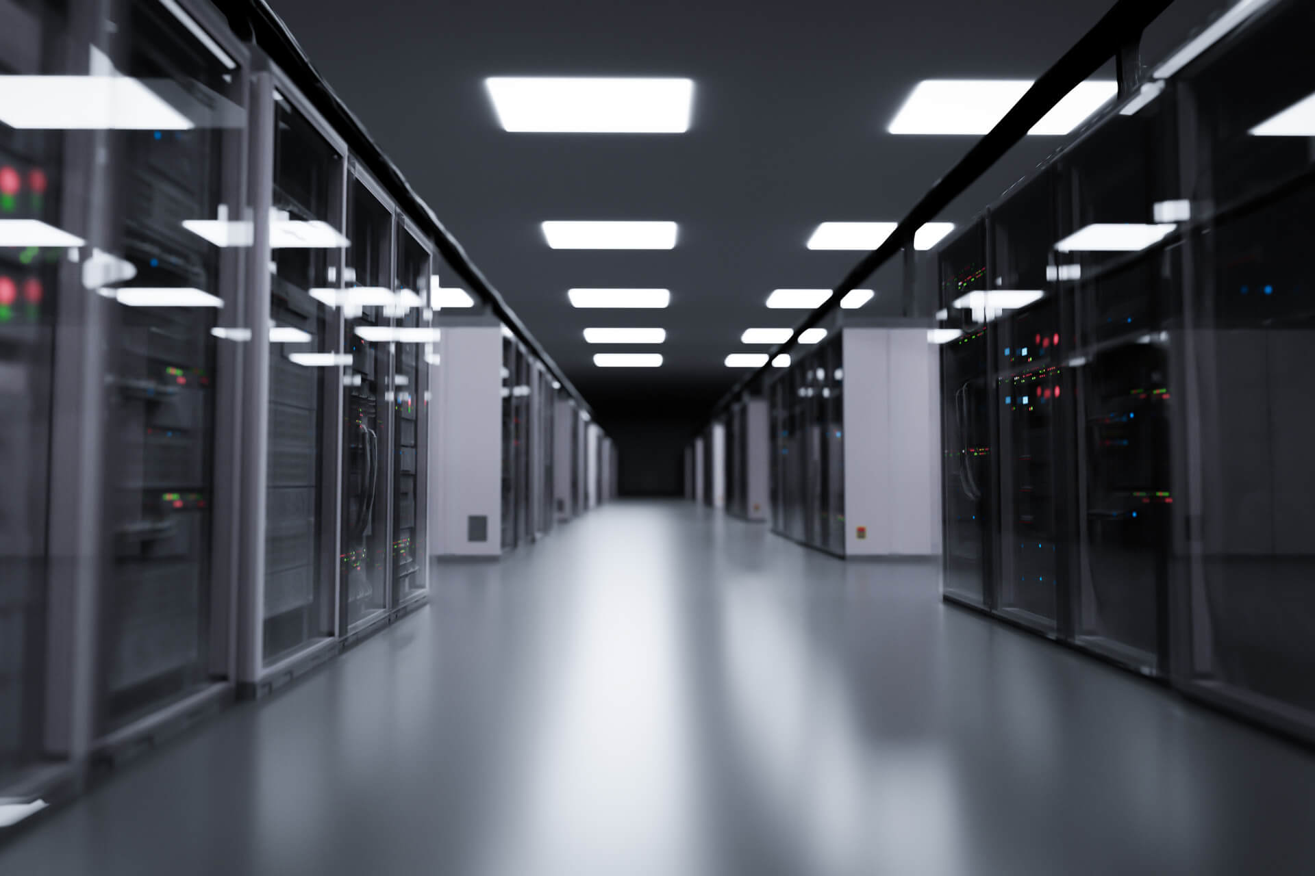 AI and Energy Powering America’s Next Great Policy Challenge A row of illuminated servers in a modern data center, representing the connection between AI and energy infrastructure.
