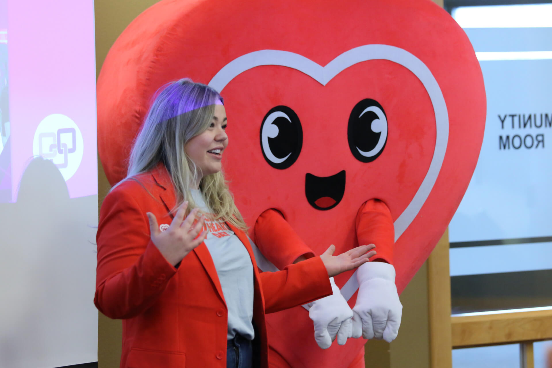 Henry the Heart pictured with a Dakota Medical Foundation representative, highlighting the spirit of generosity that fuels Giving Hearts Day
