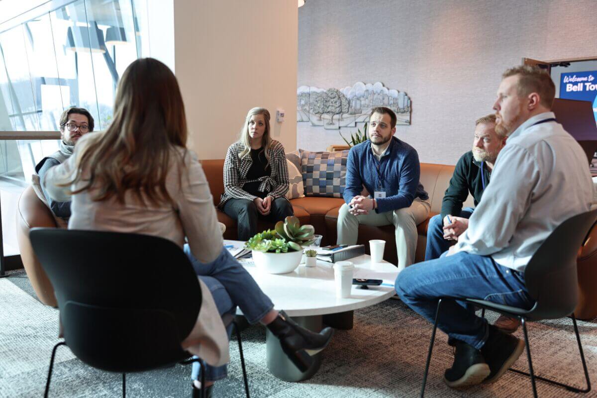 Leadership FMWF participants gather around a table for discussion