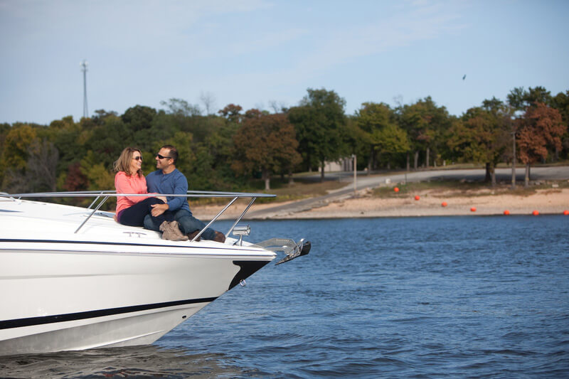 couple sitting on bow of boat