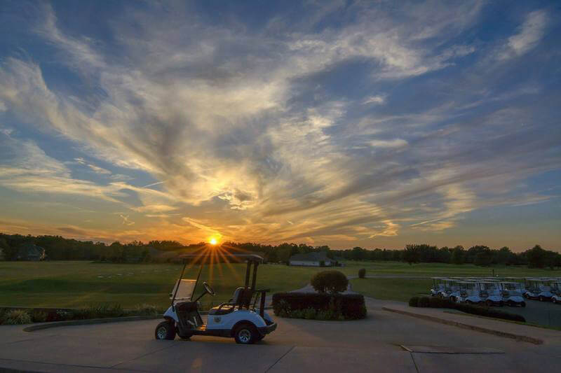 golf carts at sunset