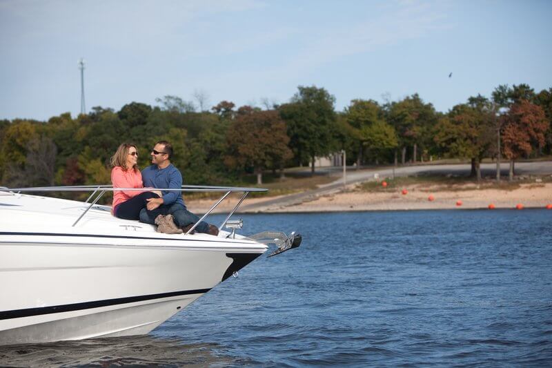 couple sitting on bow of boat