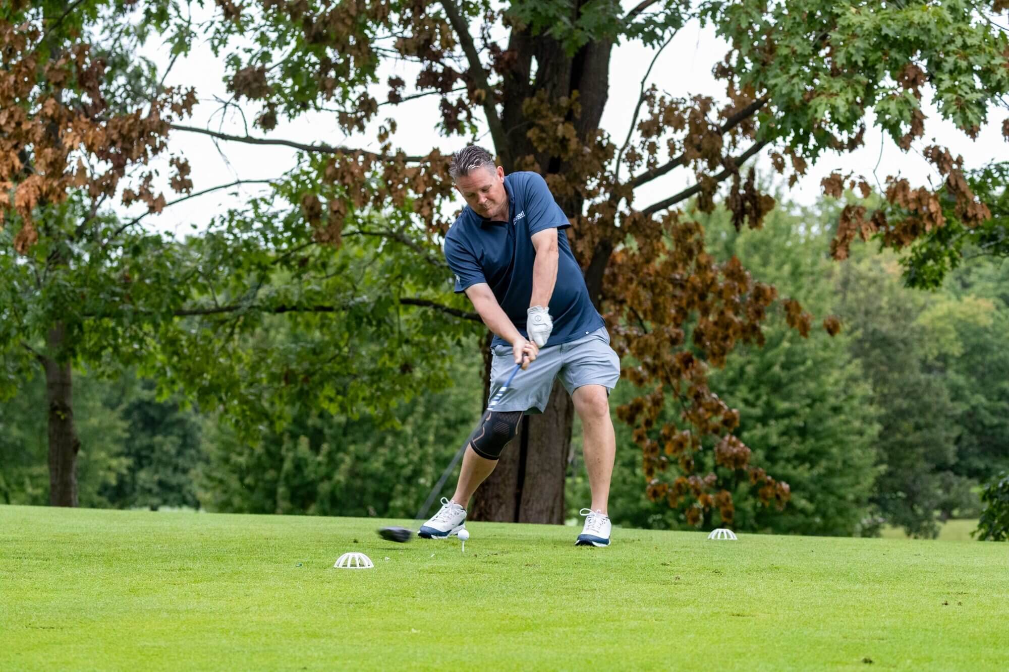 Golfer taking a shot at the 37th Annual John Wheeler Golf Outing