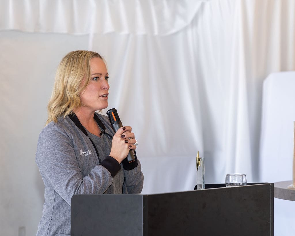 Dr. Kara Babinski receiving the 2025 Ambassador of the Year award