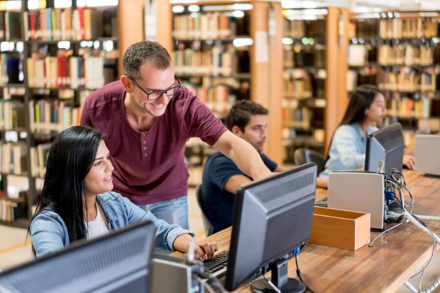 man pointing at computer screen