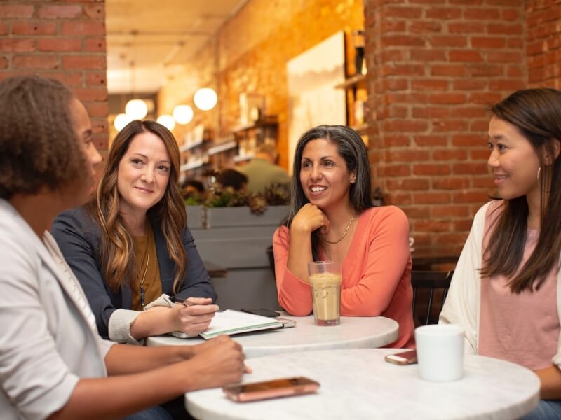 people talking around a table