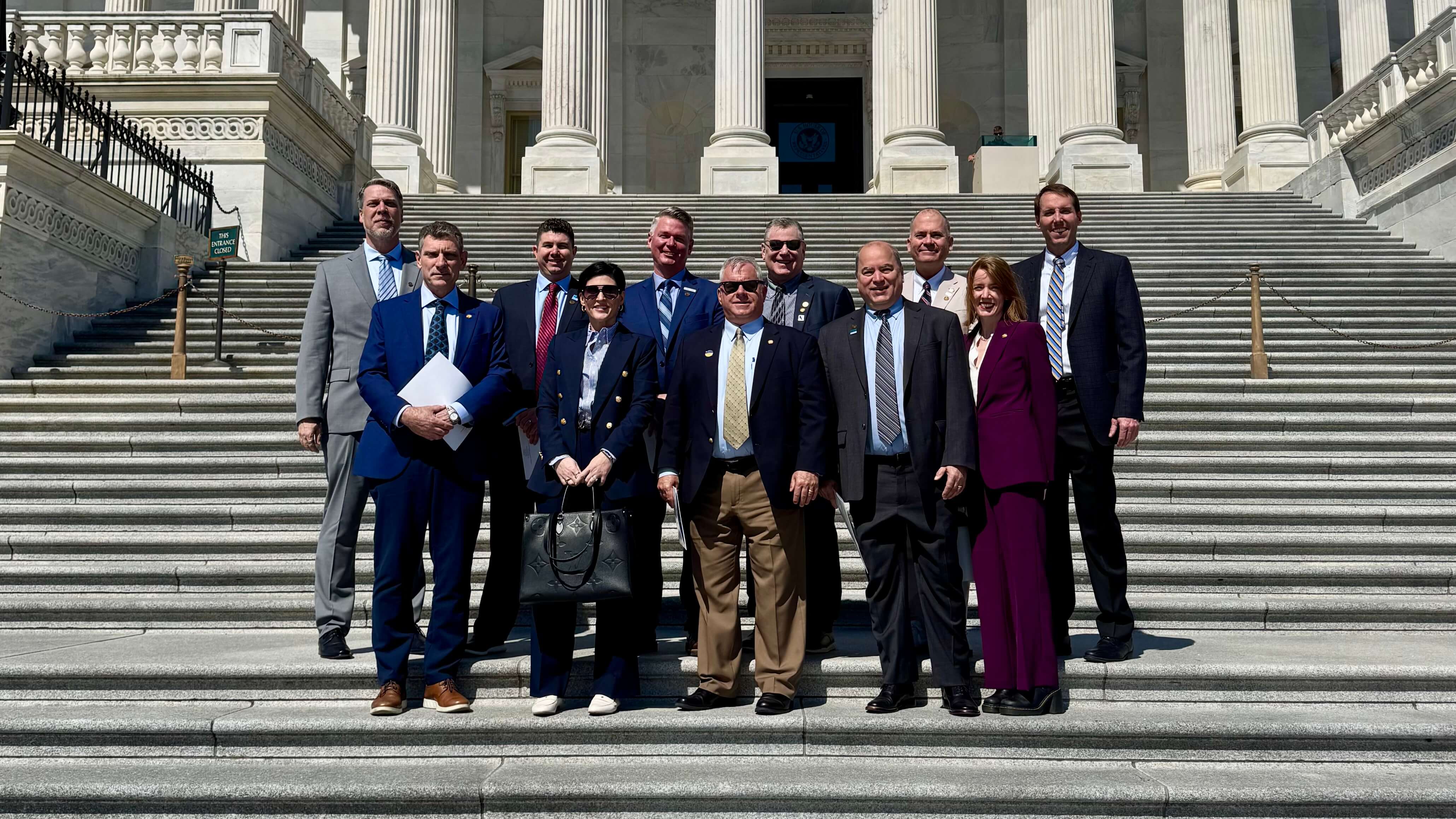 Member representatives on the National Capitol building steps