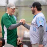Two players from opposing teams shake hands