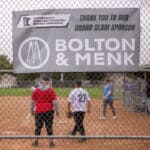 The Bolton & Menk Grand Slam Sponsor banner on the backstop