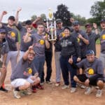 The KLJ team, playing as the Killer J's, celebrates with the Bracket B trophy
