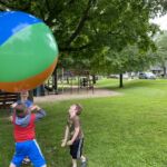 kids playing with a large ball