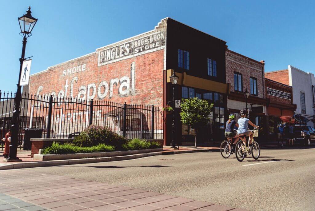 Cyclists riding through downtown Medicine Hat