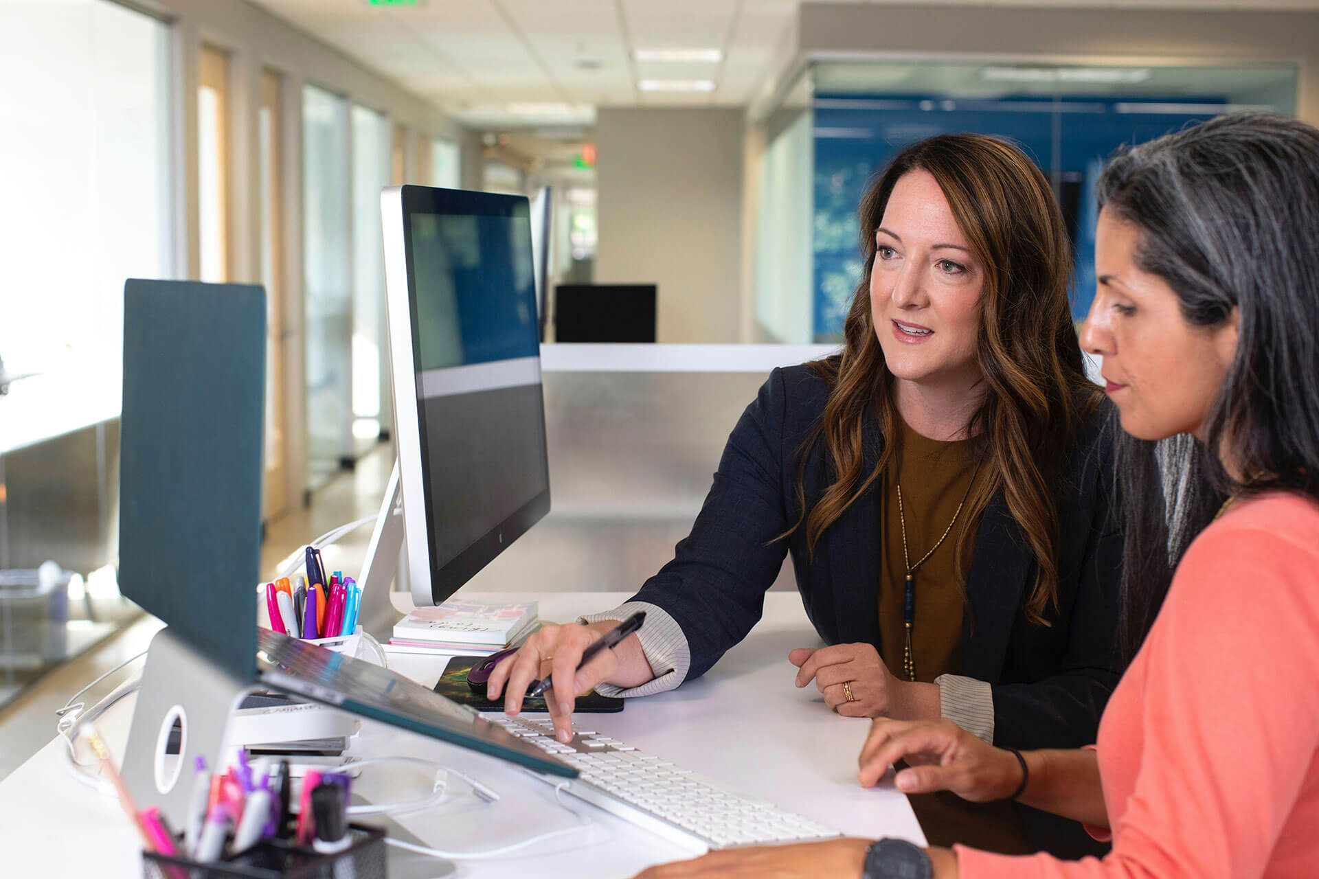 Business women working at computers in office