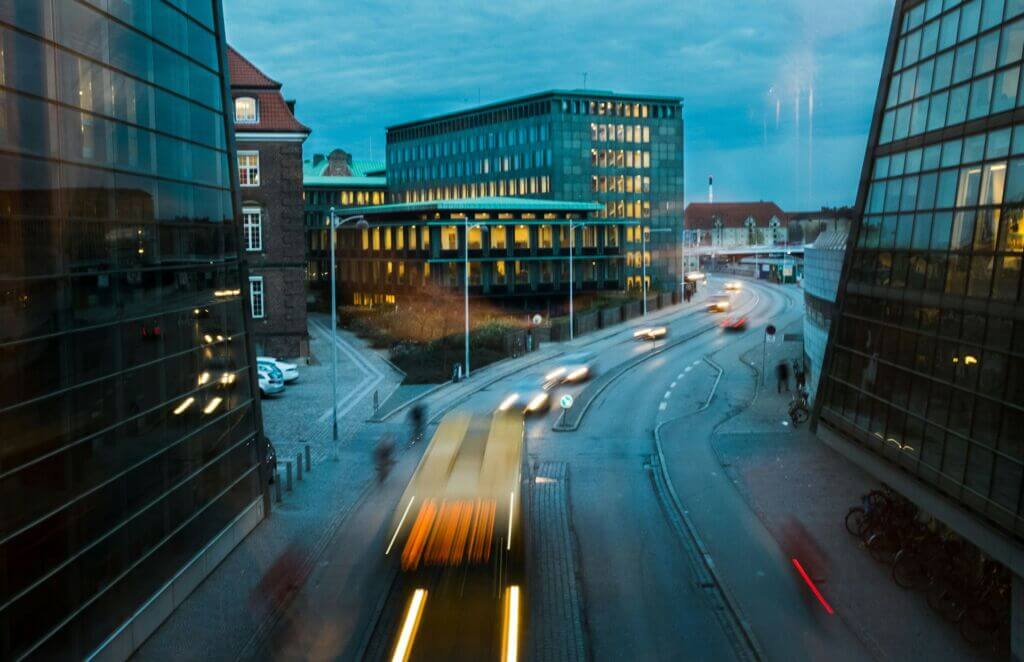 Cars driving on a road in the evening