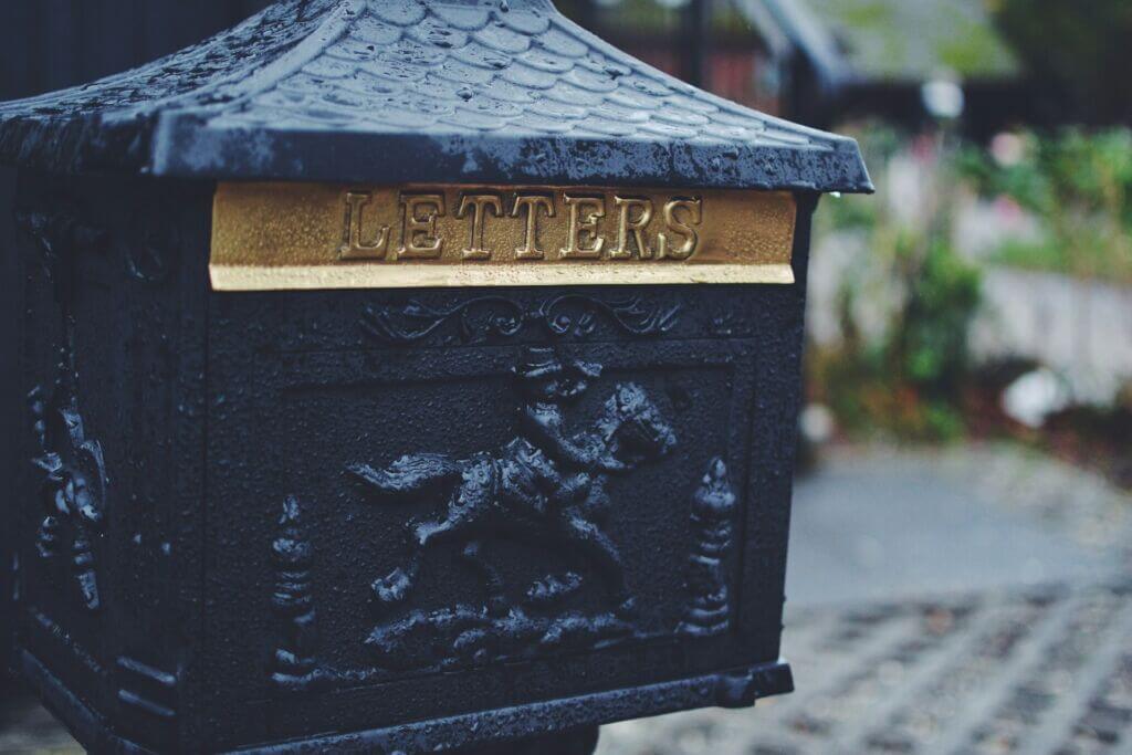 Dark blue mailbox with the word LETTERS above the slot