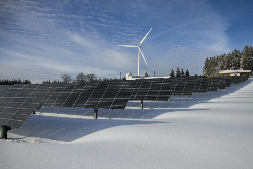 Turbine and solar panels in the snow