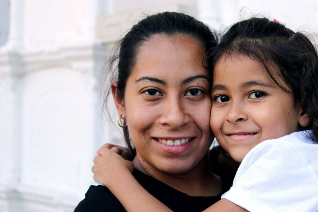 mother-child-daughter-immigration-smiling-happy mother-child-daughter-immigration-smiling-happy