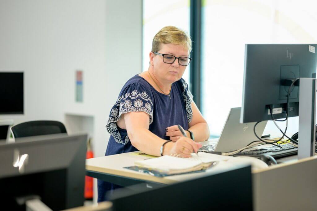 Taxes-business-owner-woman-paperwork Taxes-business-owner-woman-paperwork