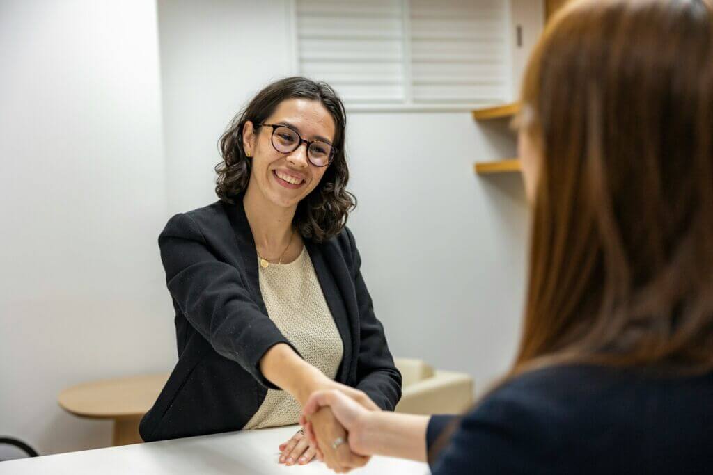 resume-hiring-onboarding-interview-office-handshake-women-business resume-hiring-onboarding-interview-office-handshake-women-business