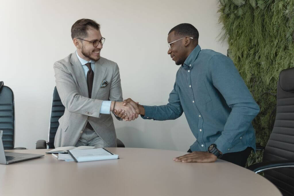 Hiring-handshake-interview-two men-business Hiring-handshake-interview-two men-business
