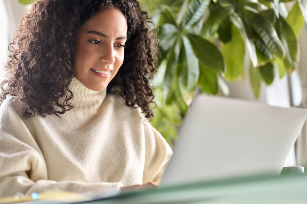 woman looking at laptop