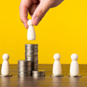 placing pawns on money stacks