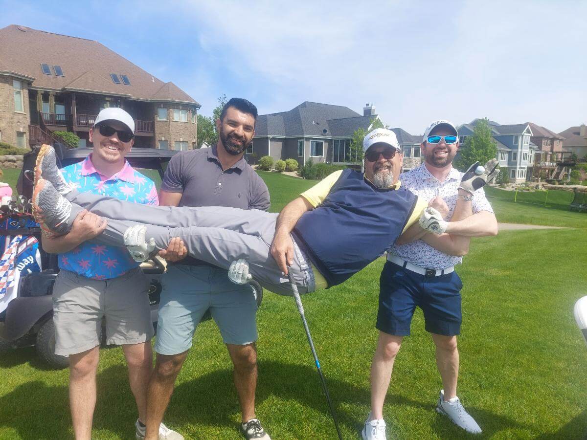 4 teamates posing at the 2024 Oregon Chamber Golf Outing