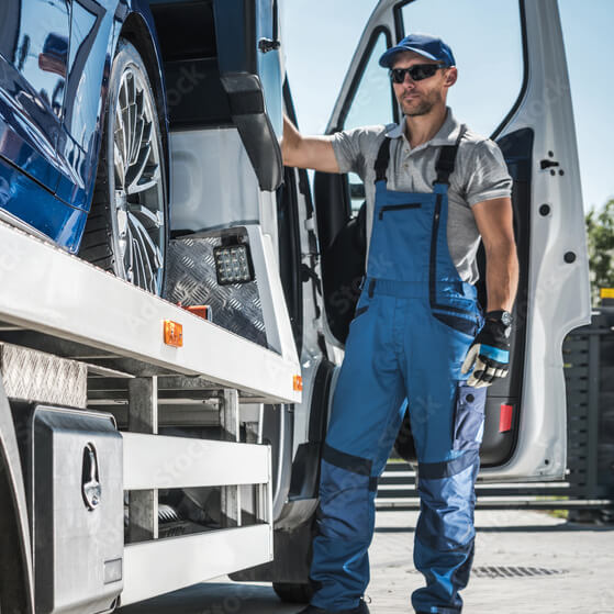 repo man loading a car on trailer