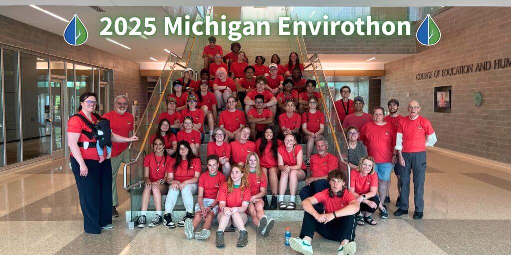 A large group of students and mentors in red shirts at the 2025 Michigan Envirothon state competition.