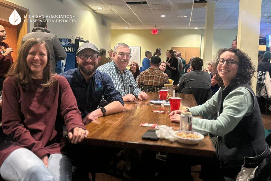 group of macd annual conference attendees having fun at game night.