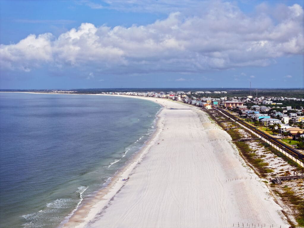 Aerial view of the white-sand coastline and community of Mexico Beach, Florida
